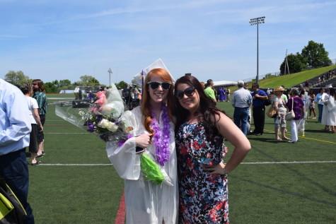 Erin Carroll shares a proud older sister moment with graduate Maddy Carroll.