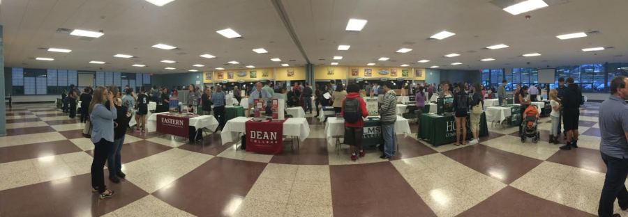 Many of the areas colleges filed into the Holyoke High cafeteria for the 2014 college fair. Photo by Ashley Morsen.