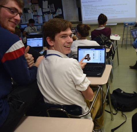 Herald staffers Aiden Moriaty and Danny Boyle caught sneaking a peek at social media. 