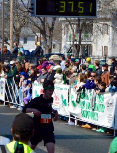 Senior Tyler Tardy at last years finish. Look to see him and other top Holyoke High runners on the route!