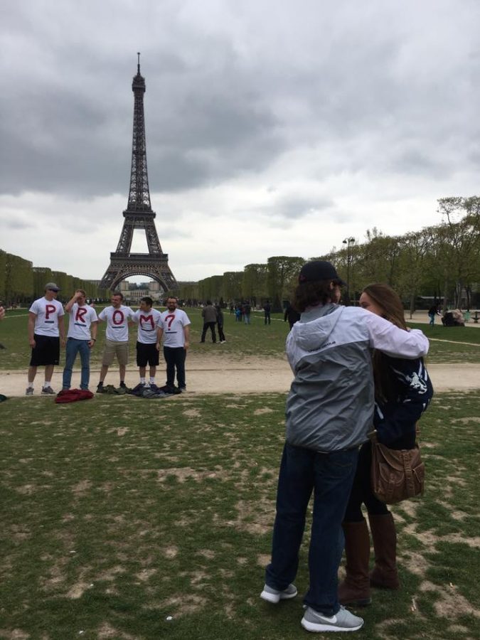 A prom-posal in front of the Eiffel Tower.