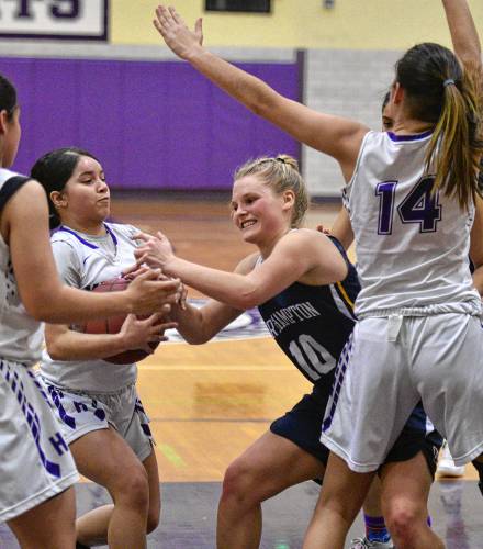 Yamaya Perez, center left, of Holyoke, steals the ball from Amanda Mieczkowski, center right, of Northampton, with Holyoke three points ahead with 28 seconds to play, Thursday, Jan. 16, 2020 at Holyoke High School. Ashley Vazquez, left, and Victoria Lopez look on.