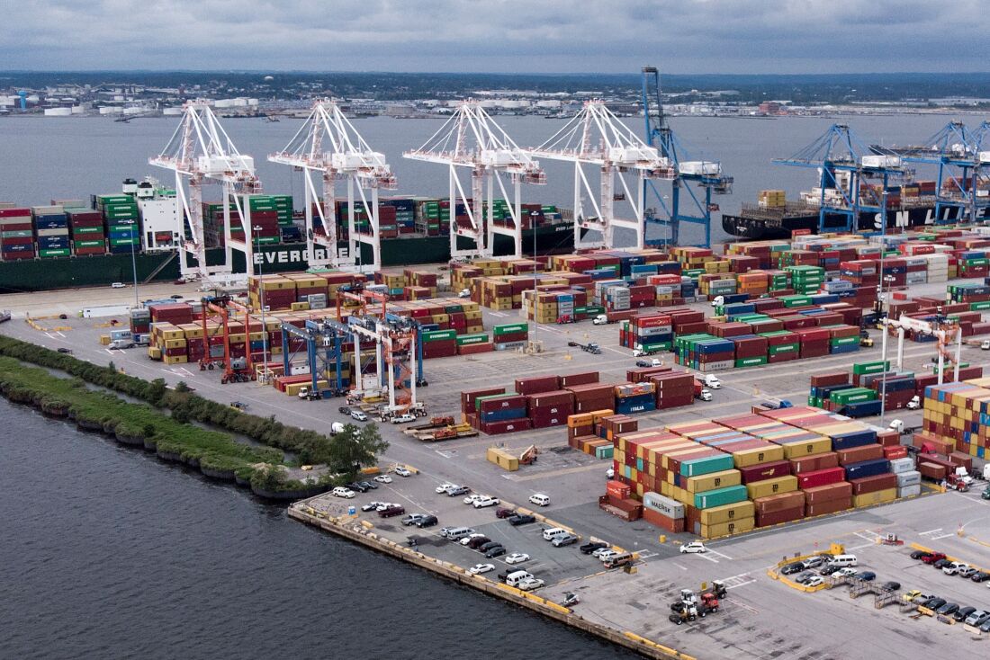 Cargo containers and tractor trailers are seen at the Seagirt Marine Terminal in the Port of Baltimore on September 21, 2018 in Baltimore, Maryland. - America's ports are fearful that they will be big losers as the escalating trade fight between Washington and Beijing bites business. The anxiety is that tit-for-tat tariffs between the two economic superpowers will crimp shipments, denting port revenues. Kurt Nagle, head of the American Association of Port Authorities, called the state of play "concerning" following the latest back and forth this week between the US and China." The total amount of tariffs and international retaliation affect 10% of the total trade in American ports," or about $160 billion in revenues, Nagle said. (Photo by Brendan Smialowski / AFP)        (Photo credit should read BRENDAN SMIALOWSKI/AFP via Getty Images)